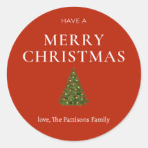 Frohe Weihnachtsgrüße mit Baum auf roten Sitten