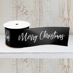 Frohe Weihnachtskalligrafie White auf schwarzen Fe Satinband