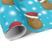 Frohe Weihnachtskartoffeln mit Weihnachtsmannmütze Geschenkpapier (Rolleneckpunkt)