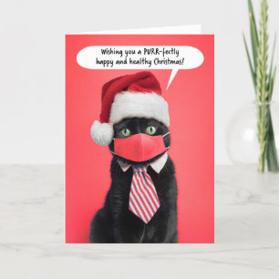 Frohe Weihnachtskatze in Coronavirus Gesichtsmaske Feiertagskarte