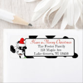 Frohe Weihnachtskuh in Weihnachtsmannmütze (Insitu)