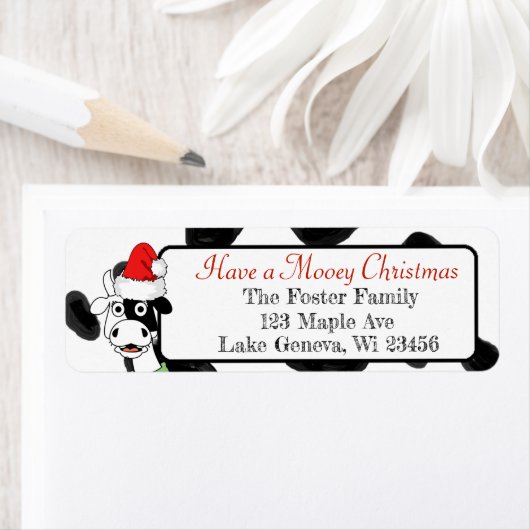 Frohe Weihnachtskuh in Weihnachtsmannmütze (Insitu)