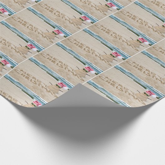 Frohe Weihnachtssandman am Strand Geschenkpapier (Ecke)