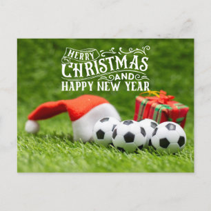 Froher Fußballurlaub mit Weihnachtsmannmütze Weihn Feiertagspostkarte