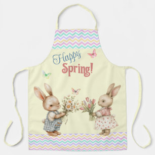 Frohes Frühjahr! Junge- und Mädchen-Hasen und Blum Schürze
