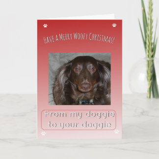 Fröhliche Woofy-Weihnachten von einem Hund zum and Feiertagskarte