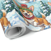 Fröhlicher Corgi-Hund springt im Schnee mit Pom-Po Geschenkpapier (Rolleneckpunkt)