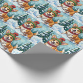 Fröhlicher Corgi-Hund springt im Schnee mit Pom-Po Geschenkpapier (Ecke)
