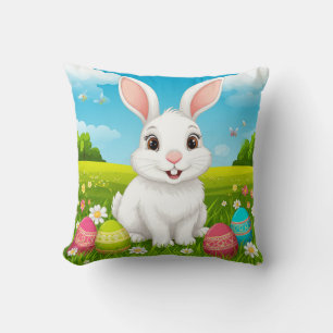 Fröhlicher Osterhase auf der Wiese mit bunten Eier Kissen