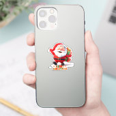 Fröhlicher Weihnachtsmann mit feierlichen Geschenk Aufkleber (Telefon)
