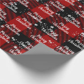 Fröhlicher Weihnachtstext in Schneeflocken auf Kar Geschenkpapier (Ecke)