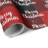 Fröhlicher Weihnachtstext in Schneeflocken auf Kar Geschenkpapier (Rolleneckpunkt)