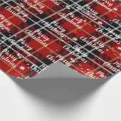 Fröhlicher Weihnachtstext in Schneeflocken auf Tar Geschenkpapier (Ecke)