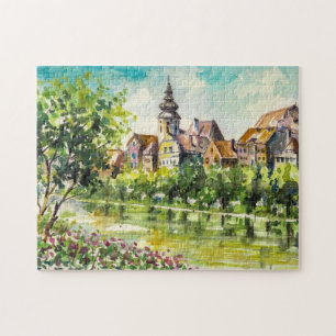 Frühling in der kleinen Stadt auf dem Fluss Puzzle