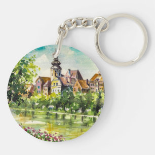 Frühling in der kleinen Stadt auf dem Fluss Schlüsselanhänger