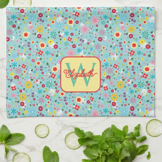 Frühlingsblumen auf aquablauem Monogramm Geschirrtuch (Gefaltet)