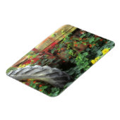 Frühlingsblumen schmücken einen alten Traktor. Magnet (Linke Seite)