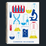 Fun Science Chemistry Laboratory Custom Blue Notizblock<br><div class="desc">Dieses unterhaltsame,  maßgeschneiderte Notebook zeichnet sich durch ein niedliches Design zum Thema Naturwissenschaften und Chemie in Primärfarben aus. Personalisieren Sie es mit Ihrem Namen. Tolle Geschenkidee!</div>
