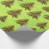 Funkelnd Weihnachtsbaum auf abstraktem Grünbuch Geschenkpapier (Ecke)
