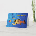 Funny Birthday Card mit Angeln Karte<br><div class="desc">Die sonnige Illustration eines Seeteuchels,  der sich bereit macht,  einen Geburtstagskuchen zu essen. Schöne Geburtstagskarte mit Happy Baitday! auf der Abdeckung. Bild und Vers Copyright © Shoaff Ballanger Studios.</div>