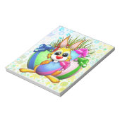 Funny Bunny biting an Easter Egg Notizblock (Rotiert)