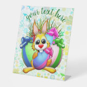 Funny Bunny biting an Easter Egg Sockelschild (Vorderseite)