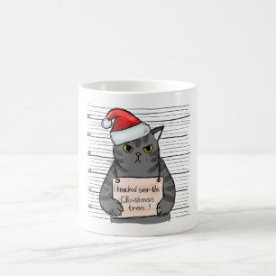 Funny Cat, den ich über Weihnachtsbaum geklopft ha Kaffeetasse