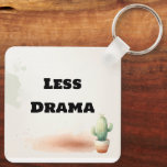 Funny Less Drama Quote Kawaii Cactus Art Schlüsselanhänger<br><div class="desc">Keep it simple and stress-free with this "Less Drama" kawaii cactus keychain! Featuring a tiny, smiling watercolor succulent and a bold, sarcastic quote, this minimalist design is perfect for those who love a touch of humor with their daily essentials. Its soft earthy tones and clean aesthetic make it a great...</div>