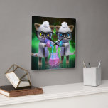 Funny Mad Cat Scientists planen Weltherrschaft Quadratische Wanduhr<br><div class="desc">AI erstellte Kunstwerke von ein paar verrückten, verrückten Katzenwissenschaftlern, die in Labrador-Coats gekleidet waren und geheimnisvolle Flüssigkeiten in einem Pullover vermischten, um die Welt zu übernehmen. (Das wäre eine wahnsinnig lustige Beobachtung, außer der Tatsache, dass sie die Welt bereits übernommen haben). Eine tolle Geschenkidee für Katzenliebhaber, Tierfreunde und alle mit...</div>