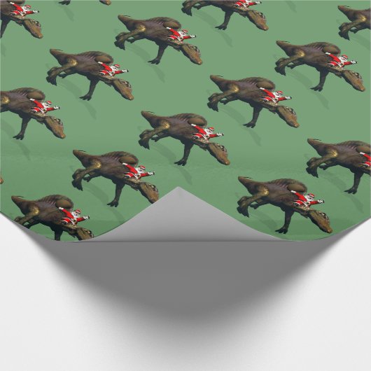 Funny Santa Claus reiten auf Spinosaurus Geschenkpapier (Ecke)