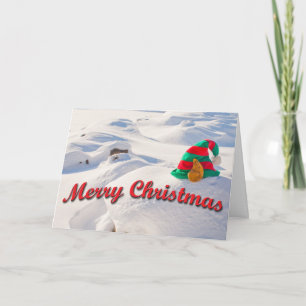 Funny Santa Elf Hut auf einem Schneetreiber Foto C Feiertagskarte