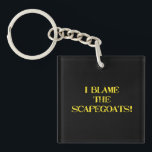 Funny Scapegoat Quote A Bold Statement on Blame Schlüsselanhänger<br><div class="desc">This striking image delivers a punchy message—"I BLAME THE SCAPEGOATS!"—in distressed yellow stencil text against a stark black background. It's a satirical take on the human tendency to deflect responsibility,  making it perfect for social commentary,  humor,  or protest-themed content. #BlameCulture #SatireArt #ScapegoatStatement #BoldTypography</div>