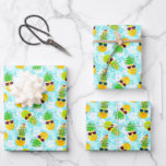Funny Tropical Christmas Pineapples Geschenkpapier Set<br><div class="desc">Funny, tropical Christmas pineapples wearing sunglasses and festively decorated with Christmas lights, ornaments and candy canes. This pattern has a pastel blue background with Hawaiian hibiscus flowers. Available here on a custom three sheet set of wrapping paper. Change the size of the pattern to your preference on each sheet if...</div>