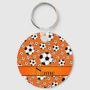 Fußbalball-Orangenstreifen des Namespaßes orange Schlüsselanhänger