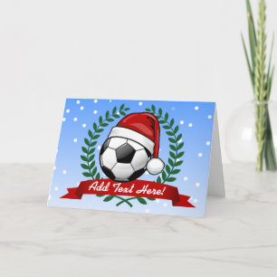 Fußball-Ball mit einer Weihnachtsmannmütze Weihnac Feiertagskarte