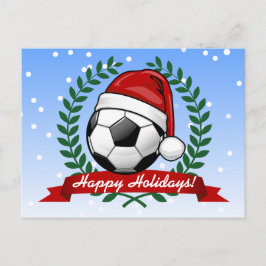 Fußball-Ball mit einer Weihnachtsmannmütze Weihnac Feiertagspostkarte