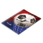 Fußball, der den roten, blauen Fußball des Mädchen Notizblock (Linke Seite)