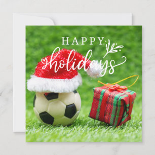 Fußball-Happy Holidays mit Ball auf grünem Gras Feiertagskarte