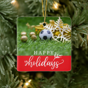 Fußball-Happy Holidays mit Ball auf grünem Gras Keramikornament