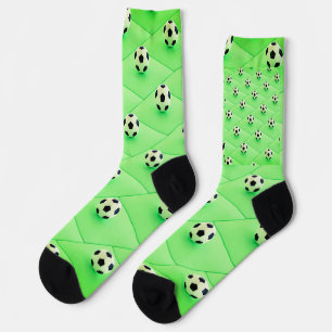 Fußball-Lüfterdesign mit grünem Hintergrund Socken