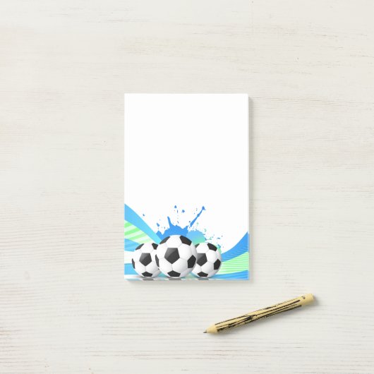 Fußball nach der Notiz (Auf Schreibtisch)