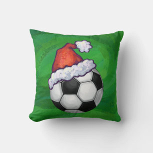 Fußball-Weihnachtsmannmütze auf Grün Kissen