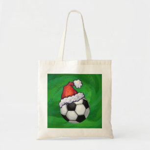 Fußball-Weihnachtsmannmütze auf Grün Tragetasche