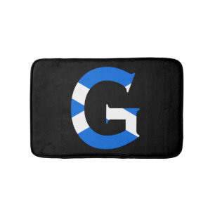 G Monogram überlagert sich auf schottischer Flagge Badematte