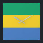 Gabon Flag Quadratische Wanduhr<br><div class="desc">Die gabunische Flagge ist ein horizontales Triband. Die verwendeten Farben in der Flagge sind blau,  grün,  gelb. Der Anteil der gabunischen Flagge beträgt 3:4. Die Flagge Gabuns wurde 1960 adoptiert.</div>