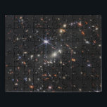 Galaxy Cluster Smacs 0723. Puzzle<br><div class="desc">Tausende von Galaxien überfluten dieses fast infrarote Bild des Galaxienhaufens SMACS 0723. Hochauflösende Bildgebung aus dem James Webb Space Teleskop in Verbindung mit einem natürlichen Effekt, der Gravitationslinseneffekt genannt wird, machte dieses fein detaillierte Bild möglich. Zuerst konzentrieren wir uns auf die Galaxien, die für den Linseneffekt verantwortlich sind: die helle,...</div>
