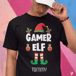 Gamer elf lustige ironische Weihnachtsfamilie Name T-Shirt<br><div class="desc">Dieser amüsante T - Shirt aus der Spielelfinale, der Teil einer passenden Kollektion von Familienelf-Kleidung ist, wird Ihnen helfen, die Urlaubsstimmung zu erleben. Dieser T - Shirt ist perfekt für jede Weihnachtsfamilie geeignet und bietet einen niedlichen Elfenhut und lustige Beine, mit der Beschriftung "Gamer elf" in einem modernen, weißen All-Caps-Schriftart....</div>