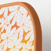 Gänseblümchen-Patch mit orangefarbenem Pickleball- Pickleball Schläger (Linke Seite)