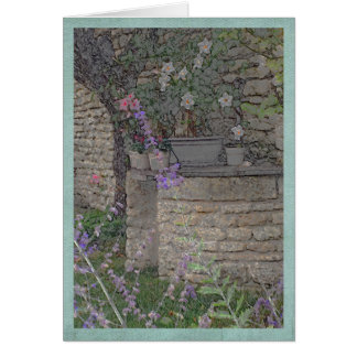Garten-Blumen und Steinbrunnen