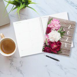 Gartenpeony Blume auf rustikalem Holz Planer